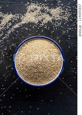Quinoa in a bowl, healthy organic wood, uncooked Quinoa in a bowl, healthy organic wood, uncooked 114095837
