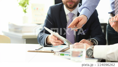 Business people discuss contract 114096262