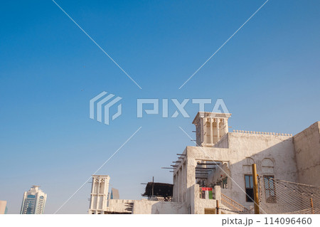 Old historic district in Dubai. traditional streets of old Dubai. Al Bastakiya district is also known as Al Fahidi Historical Neighbourhood or Al Seef 114096460