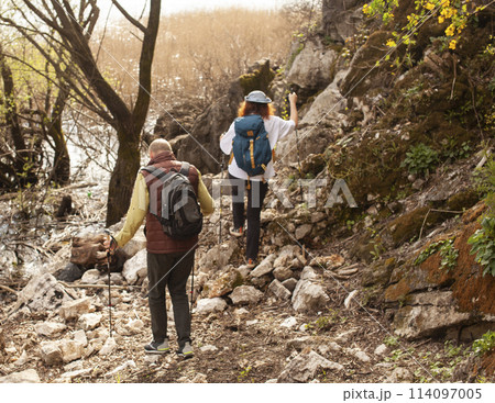 senior friends tourists outdoor adventure together on mediterranian sea landscape 114097005
