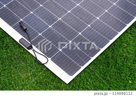 Thin flexible mobile solar panel with cable for connection. Thin flexible mobile solar panel with cable for connection. 114098112