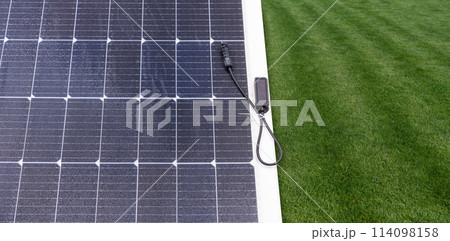Thin flexible mobile solar panel with cable for connection. Thin flexible mobile solar panel with cable for connection. 114098158