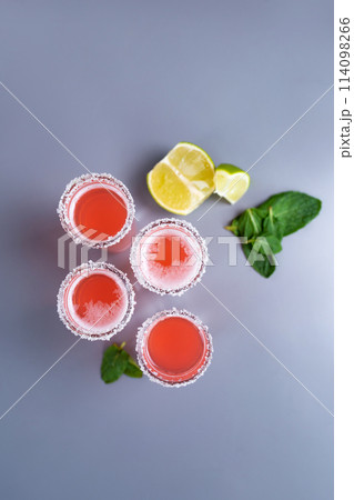 set of four pink cocktails with lime and mint top view set of four pink cocktails with lime and mint top view 114098266