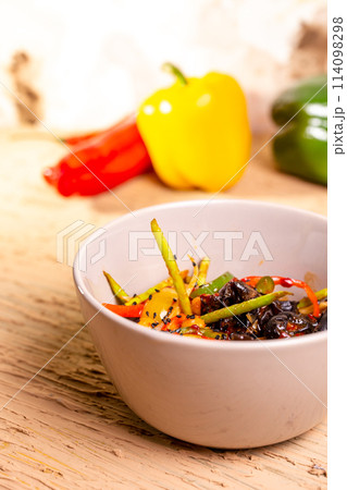Colorful vegetable salad with tomatoes, peppers, and cucumbers 114098298