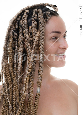 A half profile portrait of a woman with dreadlocks A half profile portrait of a woman with dreadlocks 114098611