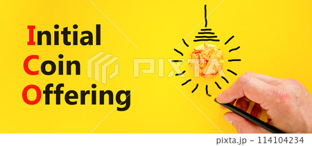 ICO initial coin offering symbol. Concept words ICO initial coin offering on beautiful paper. Beautiful yellow background. Businessman hand. Business ICO initial coin offering concept. Copy space 114104234