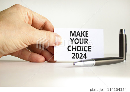 Make your choice 2024 symbol. Concept words Make your choice 2024 on beautiful white paper. Beautiful white background. Voter hand. Business Make your choice 2024 concept. Copy space Make your choice 2024 symbol. Concept words Make your choice 2024 on beautiful white paper. Beautiful white background. Voter hand. Business Make your choice 2024 concept. Copy space 114104324