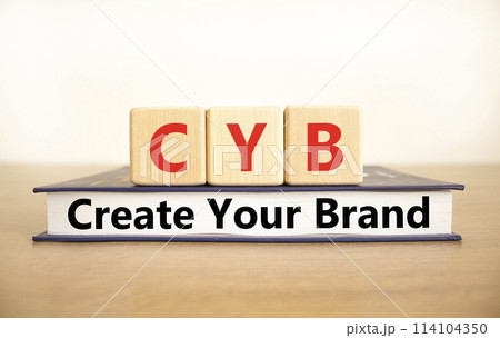 CYB Create your brand symbol. Concept words CYB Create your brand on beautiful wooden blocks and book. Beautiful white background. Business CYB Create your brand concept. Copy space. CYB Create your brand symbol. Concept words CYB Create your brand on beautiful wooden blocks and book. Beautiful white background. Business CYB Create your brand concept. Copy space. 114104350