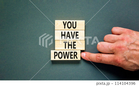 You have the power symbol. Concept word You have the power on beautiful wooden block. Beautiful grey background. Businessman hand. Business motivational you have the power concept. Copy space. 114104396