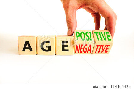 Age positivity or negativity symbol. Concept word Age positivity or Age negativity. Beautiful white background. Psychologist hand. Psychological age positivity or negativity concept. Copy space. 114104422