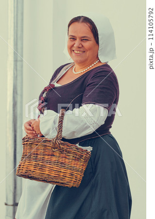 Portrait of brunette woman dressed in historical Baroque clothes with old fashion hairstyle Portrait of brunette woman dressed in historical Baroque clothes with old fashion hairstyle 114105792