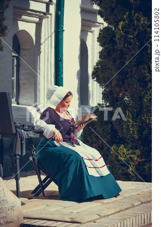 Portrait of brunette woman dressed in historical Baroque clothes with old fashion hairstyle 114105802