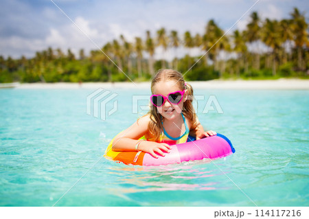 Child on tropical beach. Sea vacation with kids. 114117216