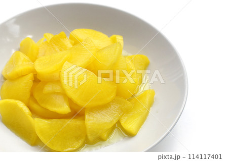 Sweet and tart slices of yellow pickled daikon, known as takuan in Japan and danmuji in Korea. 114117401