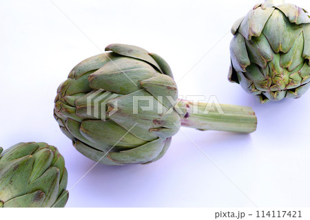 Fresh artichoke on white background. Fresh artichoke on white background. 114117421