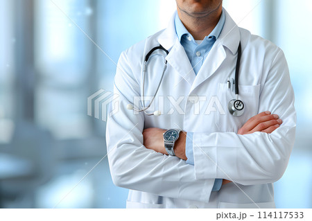 Doctor in workwear with arms crossed and stethoscope around neck Doctor in workwear with arms crossed and stethoscope around neck 114117533