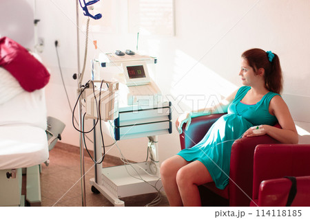 Young mother giving birth to a baby Young mother giving birth to a baby 114118185