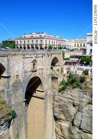 Puente Nuevo arch bridge over the Tajo gorge at Ronda village, Spain. Tourist viewpoint cliff in Ronda province of Malaga, Andalucia 114119049
