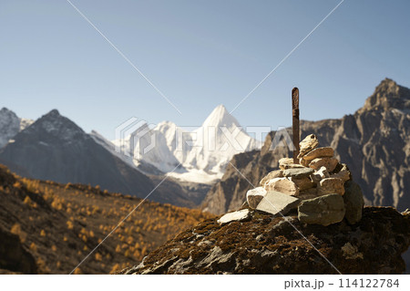 pile of prayer stones in front of mount jampayang in yading national park, china 114122784