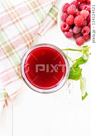 Jam of raspberry in jar on light board top Jam of raspberry in jar on light board top 114124521