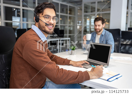 Colleagues working in collaborative office environment Colleagues working in collaborative office environment 114125733