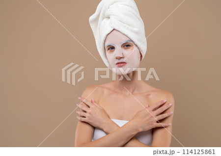 Young woman with rejuvenating mask on face Young woman with rejuvenating mask on face 114125861