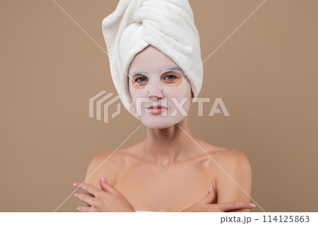 Attractive woman with cosmetic mask on face 114125863