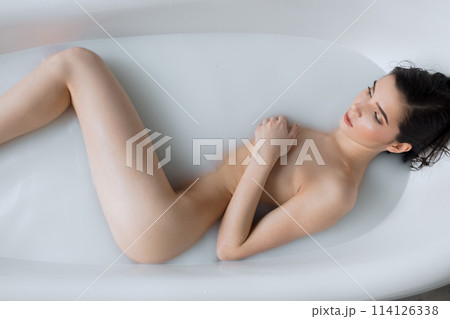 Beautiful young woman taking bath at home 114126338