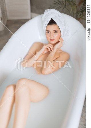Beautiful young woman taking bath at home 114126353