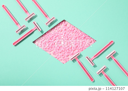 Pink razor for shaving with granules for depilation 114127107