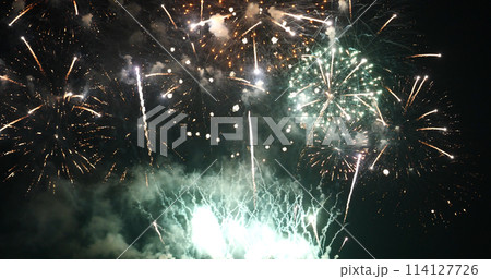 Green Firework celebrate anniversary happy new year 2022, 4th of july holiday festival. Green firework in night time celebrate national holiday. Countdown to new year 2022 festival party time event Green Firework celebrate anniversary happy new year 2022, 4th of july holiday festival. Green firework in night time celebrate national holiday. Countdown to new year 2022 festival party time event 114127726