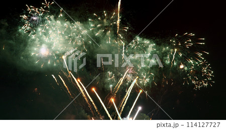 Colorful vibrant Firework celebrate anniversary happy new year 2022, 4th of july holiday festival. colorful firework in the night time to celebrate national holiday. countdown new year 2022 party time 114127727