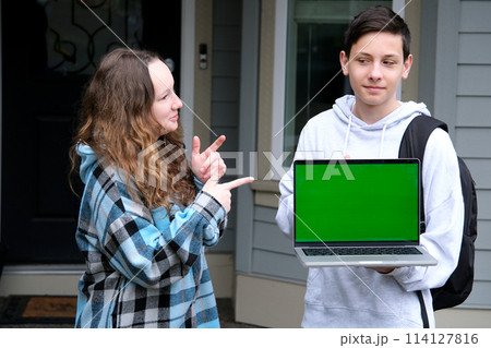 girl pointing her finger at the monitor screen green screen laptop is a close-up teen product ad stern shoulder near his home delivery delicious food space for text free space photography girl pointing her finger at the monitor screen green screen laptop is a close-up teen product ad stern shoulder near his home delivery delicious food space for text free space photography 114127816