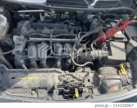 Charging a car battery in winter. Help on the road. Close-up. Connecting high voltage wires to the car battery. Resuscitation of the car in severe winter conditions 114128067