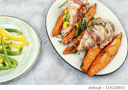 Meat roll and roasted sweet potatoes. 114128853