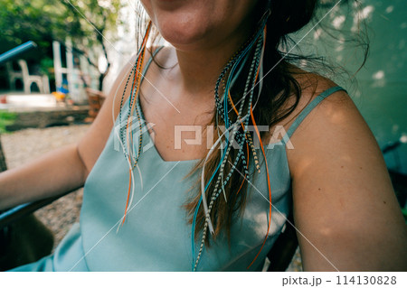 Handmade feather earrings or handicraft colorful earrings with feathers Handmade feather earrings or handicraft colorful earrings with feathers 114130828