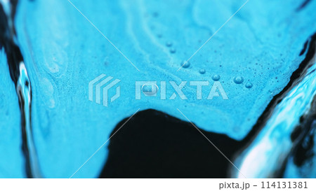 Ink emulsion. Shimmer flow mix. Defocused blue black color drip oil paint wet gloss glitter liquid blend wave motion abstract art background. 114131381