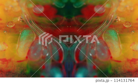 Oil bubbles. Paint fractal. Defocused yellow red green blue color transparent glitter mist texture ink mix drop floating symmetrical ornament abstract art background. 114131764
