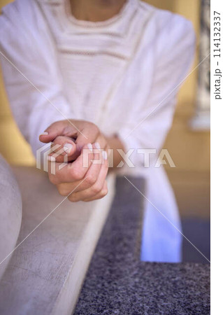 elegant middle age woman in white vintage dress near theater with antique colonnades 114132337