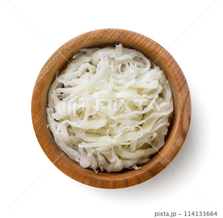 Dried squid in a wooden plate on a white background. Top view 114133664