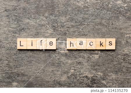 life hacks word written on wood block. life hacks text on table, concept 114135270