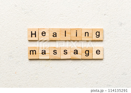 healing massage word written on wood block. healing massage text on cement table for your desing, concept 114135291