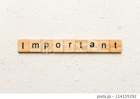 important word written on wood block. important text on cement table for your desing, concept 114135292