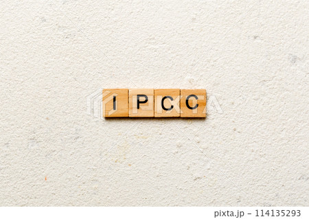 IPCC word written on wood block. abbreviation Intergovernmental Panel on Climate Change text on cement table for your desing, concept 114135293