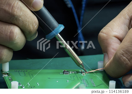 Close up scene the soldering operation by skill operator. 114136189