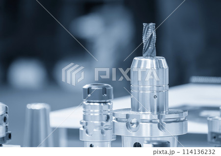 Close-up scene rough utter end mill tool with the holder in the light blue scene. Close-up scene rough utter end mill tool with the holder in the light blue scene. 114136232