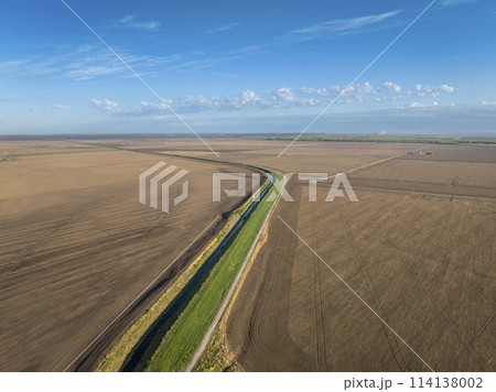 Steamboat Trace, bike trail converted from an abandoned railroad, running through Nebraska farmland near Peru, springtime aerial view Steamboat Trace, bike trail converted from an abandoned railroad, running through Nebraska farmland near Peru, springtime aerial view 114138002