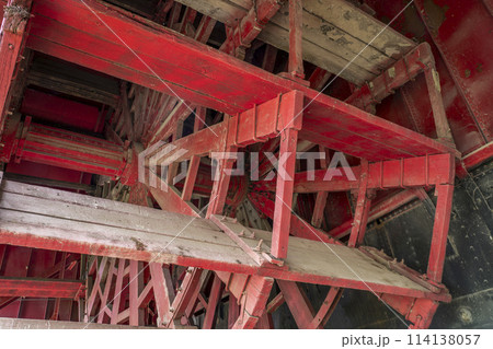 detail of wooden paddle wheel of Captain Meriwether Lewis sidewheeler dredge displayed in a dry dock in Brownville, Nebraska 114138057