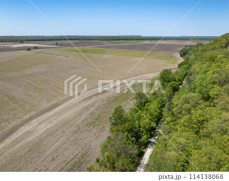 KATY biking trail running along the edge of a wide valley of the Missouri Rive, near WIlton, MO, springtime aerial view KATY biking trail running along the edge of a wide valley of the Missouri Rive, near WIlton, MO, springtime aerial view 114138068