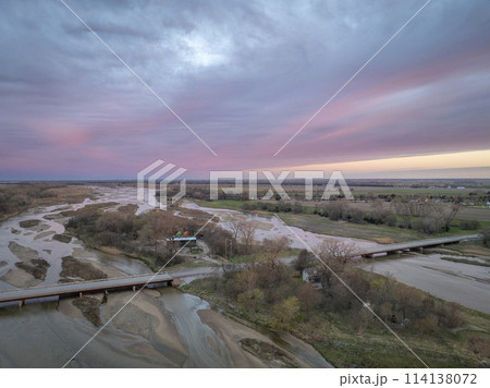 springtime sunrise over Platte River and plains near Kerney, Nebraska 114138072